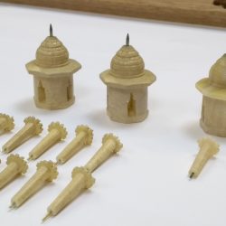 Taj Mahal model parts on a white table