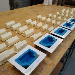 Cast model houses and blue rubber moulds