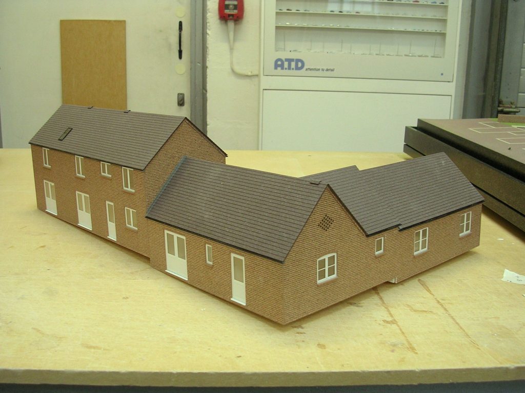 Scale model house placed on a bench, Sheffield