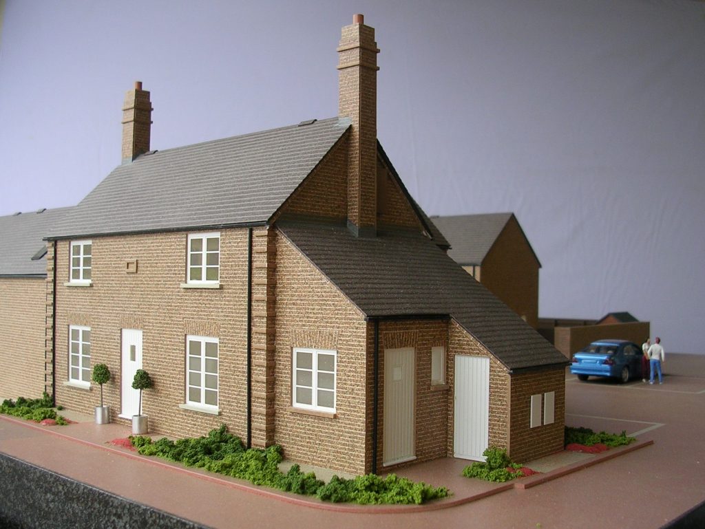 Scale model of traditional farmhouse, brown brick, Sheffield area